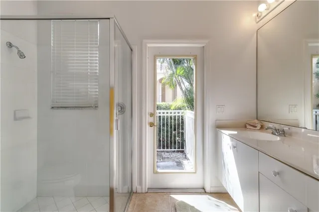 a bathroom with a shower and a sink