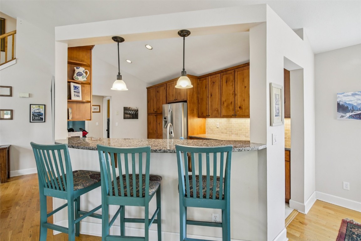 147 Blue Grouse Lane Silverthorne, CO 80498 - Photo 20 of 50 a view of a dining room with furniture window and wooden floor
