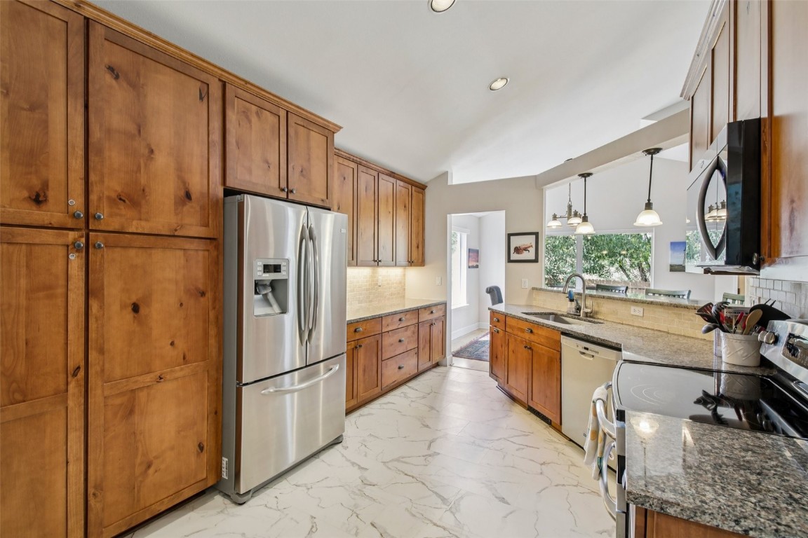 147 Blue Grouse Lane Silverthorne, CO 80498 - Photo 23 of 50 a kitchen with stainless steel appliances a refrigerator and a sink