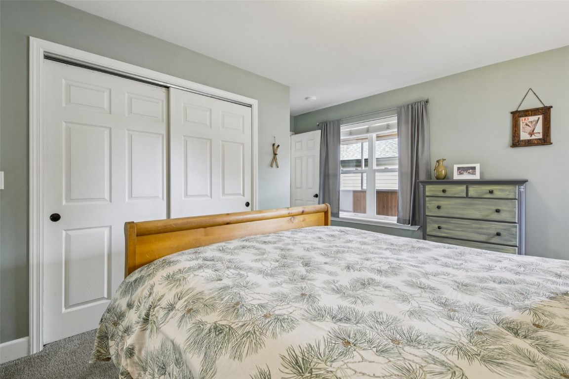 147 Blue Grouse Lane Silverthorne, CO 80498 - Photo 28 of 50 a bed room with a bed and a window