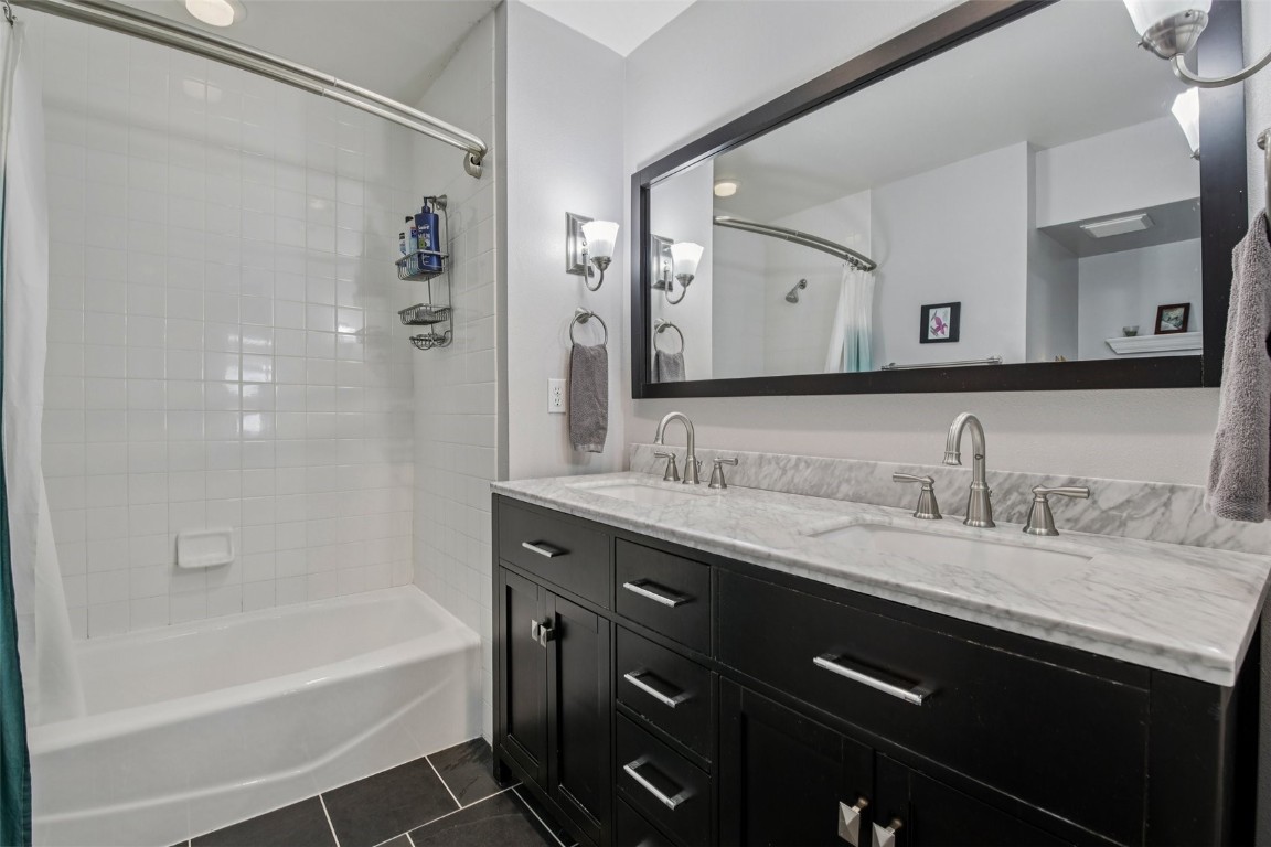 147 Blue Grouse Lane Silverthorne, CO 80498 - Photo 29 of 50 a bathroom with a granite countertop sink mirror and a bath tub