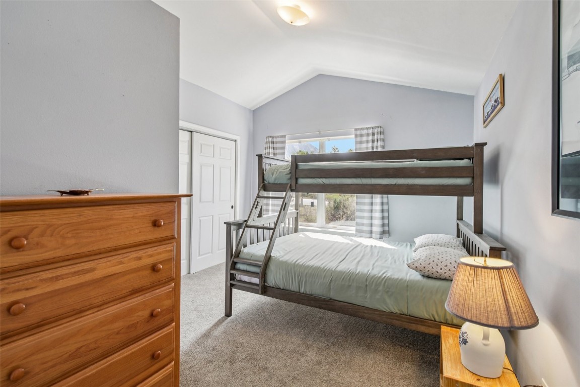 147 Blue Grouse Lane Silverthorne, CO 80498 - Photo 30 of 50 a bedroom with a bed and a window