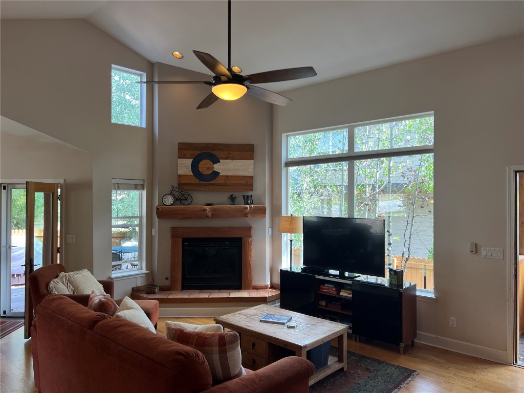 147 Blue Grouse Lane Silverthorne, CO 80498 - Photo 38 of 50 a living room with furniture a flat screen tv and a fireplace