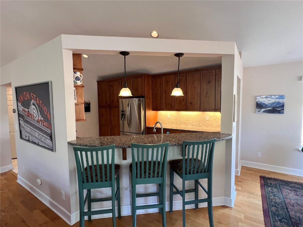 147 Blue Grouse Lane Silverthorne, CO 80498 - Photo 48 of 50 a view of a dining room with furniture and window