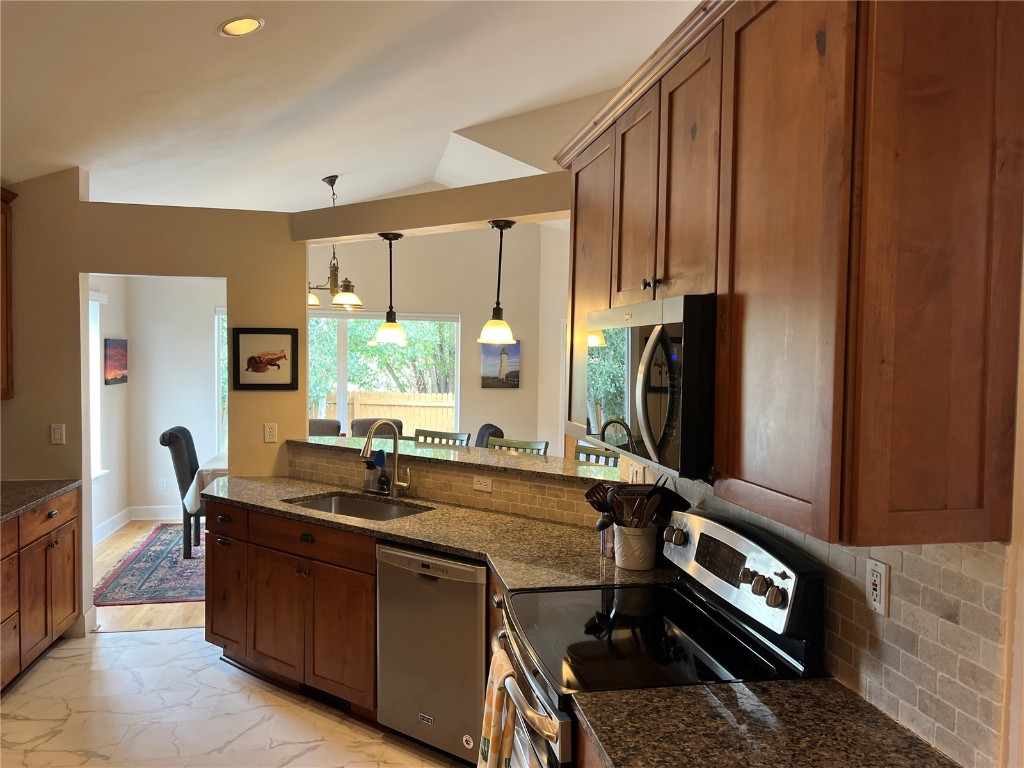 147 Blue Grouse Lane Silverthorne, CO 80498 - Photo 50 of 50 a kitchen with sink refrigerator and window