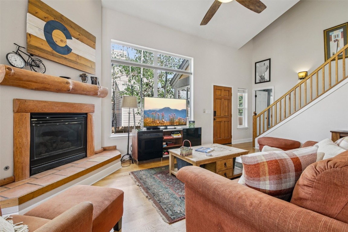 147 Blue Grouse Lane Silverthorne, CO 80498 - Photo 5 of 50 a living room with furniture fireplace and flat screen tv