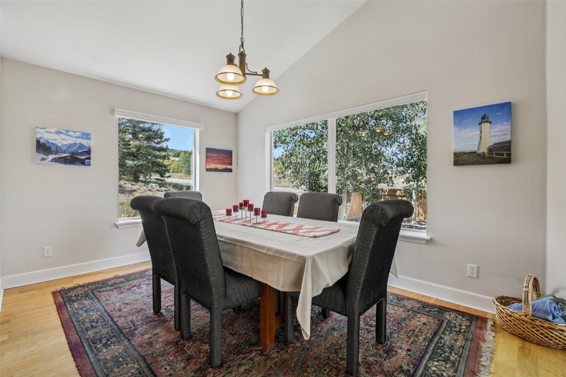 147 Blue Grouse Lane Silverthorne, CO 80498 - Photo 6 of 50 a view of a dining room with furniture window and outside view