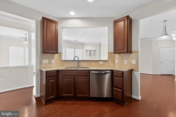 a spacious bathroom with a granite countertop sink and a mirror