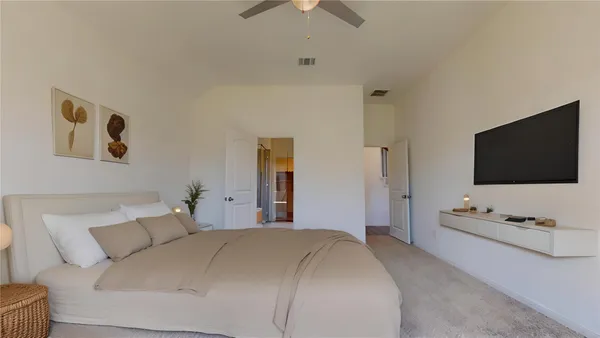 an empty room with a ceiling fan and a window