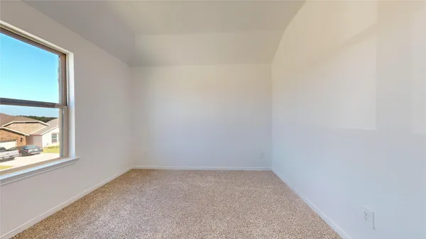 a white bath tub sitting next to a white sink and vanity