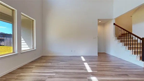 a view of kitchen with cabinets and wooden floor