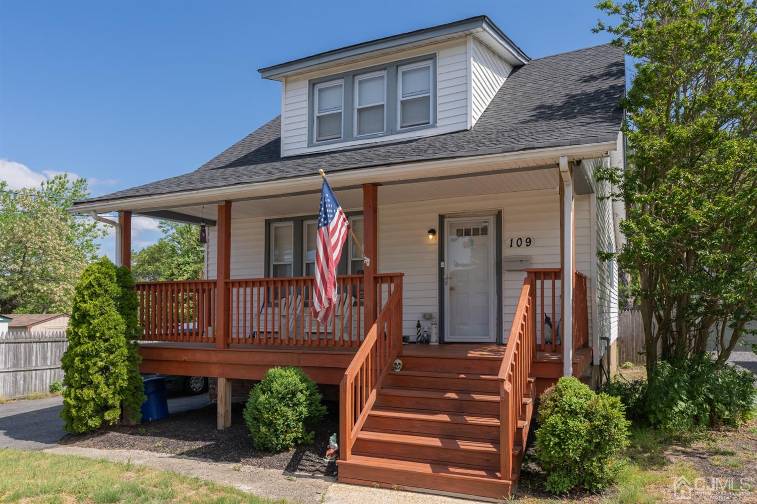 109 Stone Road Union Beach, NJ 07735 - Photo 1 of 21 a front view of a house with a garden