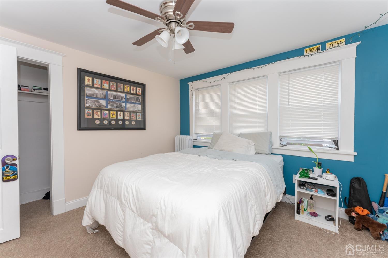 109 Stone Road Union Beach, NJ 07735 - Photo 15 of 21 a bedroom with a bed dresser and a window