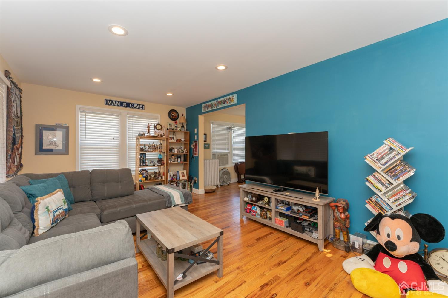 109 Stone Road Union Beach, NJ 07735 - Photo 3 of 21 a living room with furniture and a flat screen tv