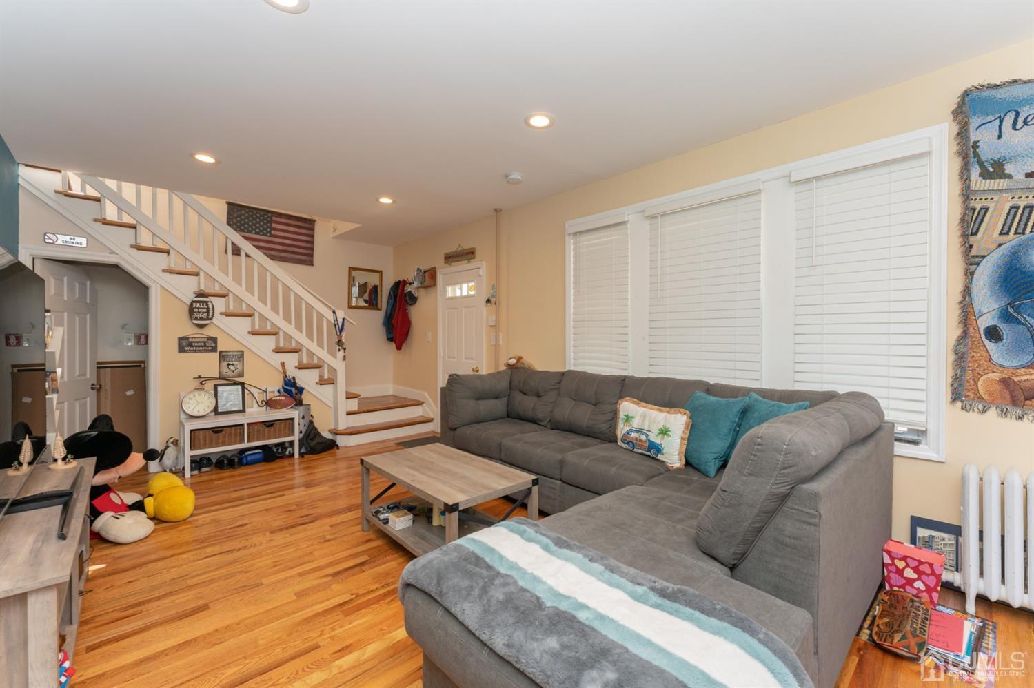 109 Stone Road Union Beach, NJ 07735 - Photo 4 of 21 a living room with furniture and wooden floor