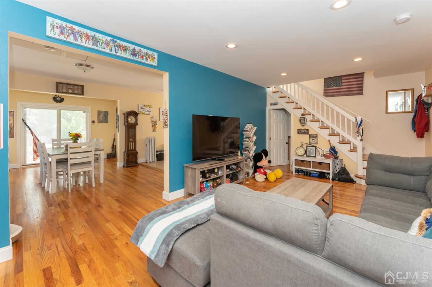 109 Stone Road Union Beach, NJ 07735 - Photo 5 of 21 a living room with furniture and a flat screen tv