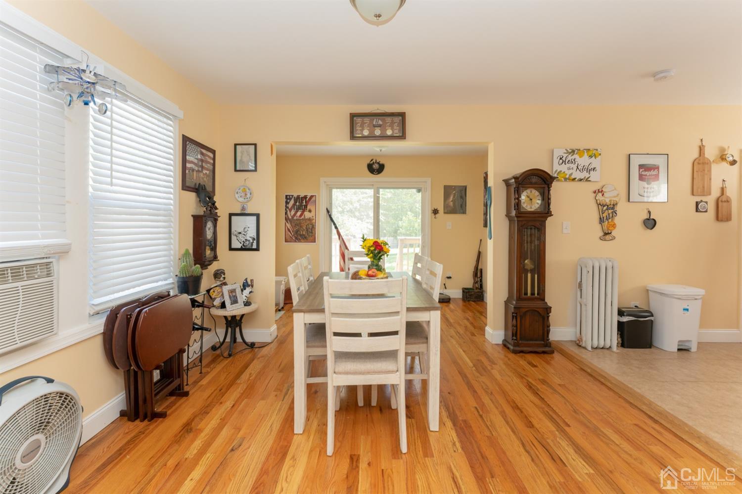 109 Stone Road Union Beach, NJ 07735 - Photo 6 of 21 a dining room with furniture and wooden floor