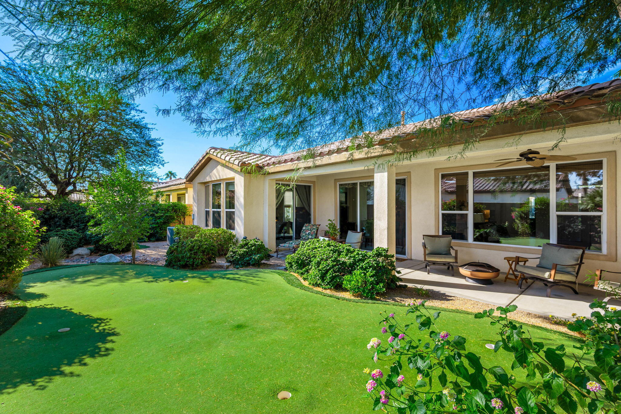 60246 Sweetshade Lane La Quinta, CA 92253 - Photo 1 of 76 a view of a house with backyard and porch