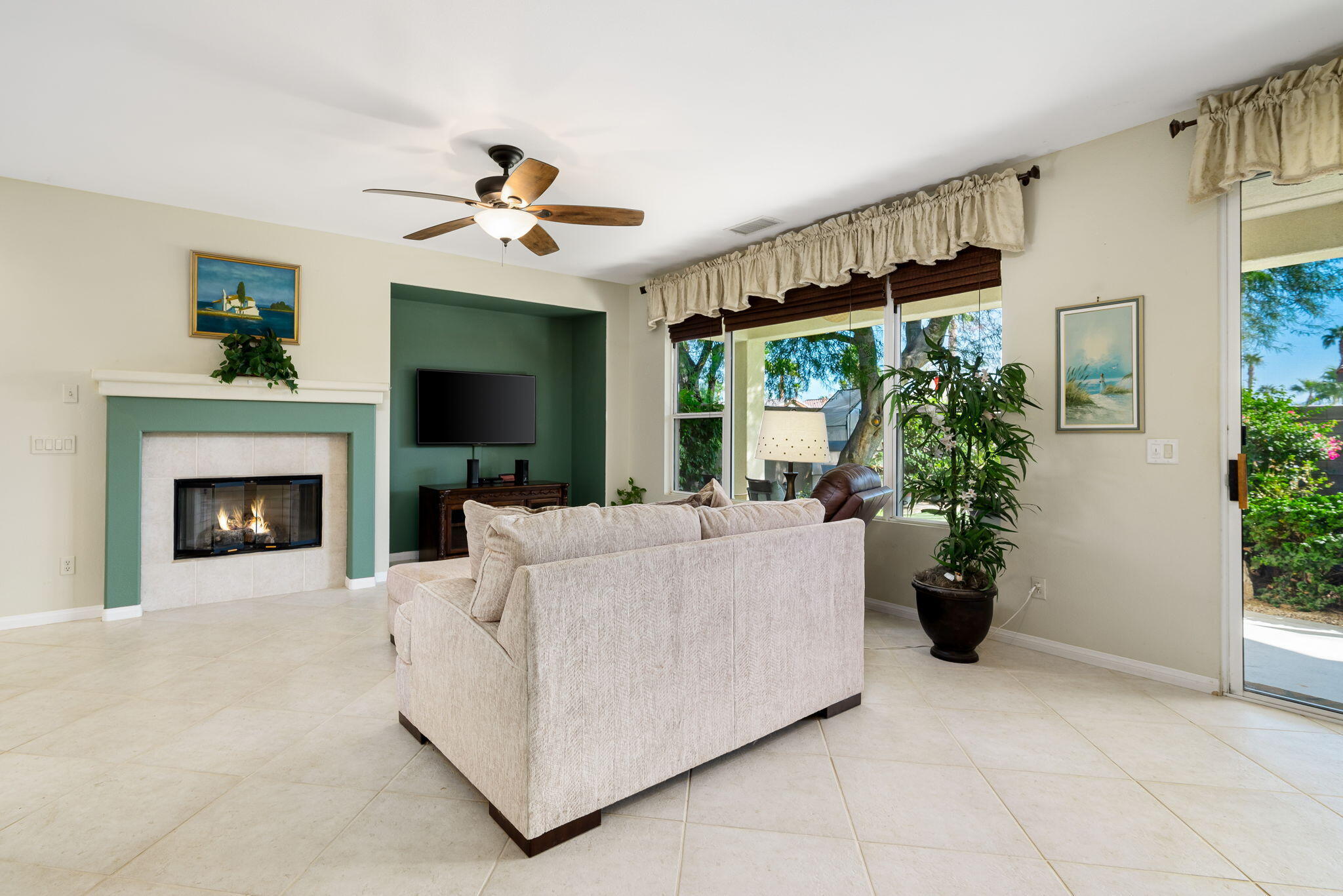 60246 Sweetshade Lane La Quinta, CA 92253 - Photo 11 of 76 a living room with furniture and a fireplace