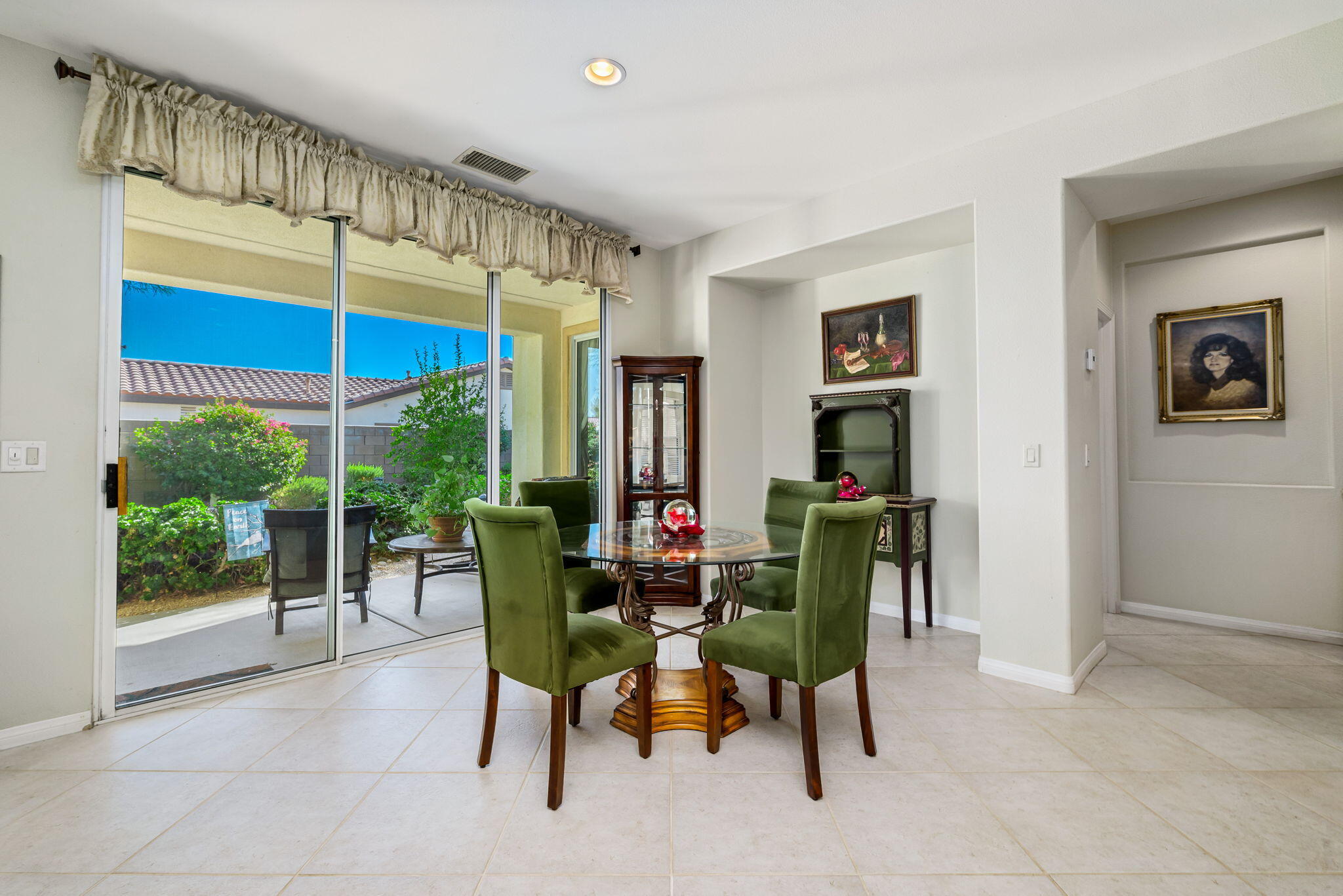 60246 Sweetshade Lane La Quinta, CA 92253 - Photo 14 of 76 a view of a dining room with furniture and window