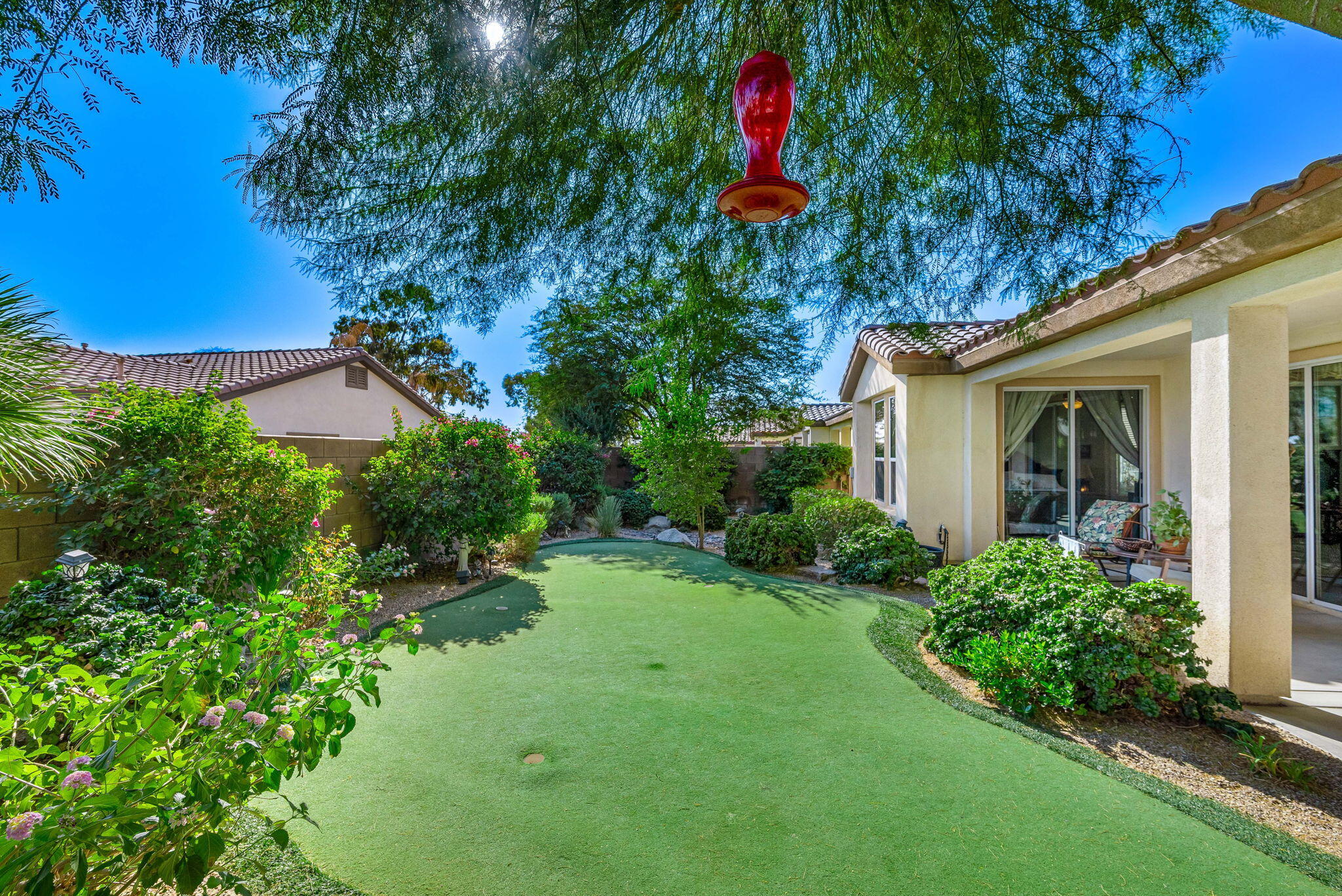 60246 Sweetshade Lane La Quinta, CA 92253 - Photo 31 of 76 a backyard of a house with lots of green space