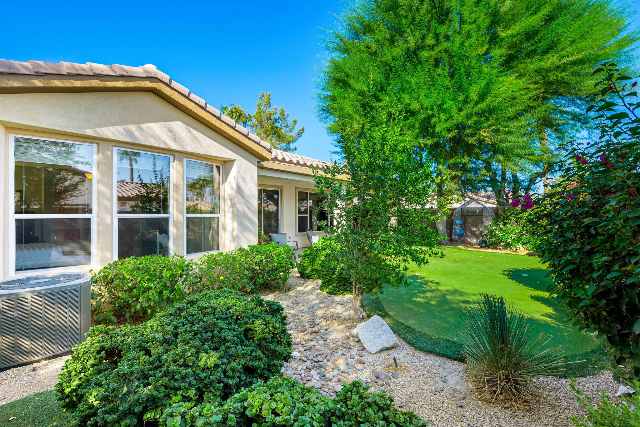 60246 Sweetshade Lane La Quinta, CA 92253 - Photo 35 of 76 a view of a house with a yard