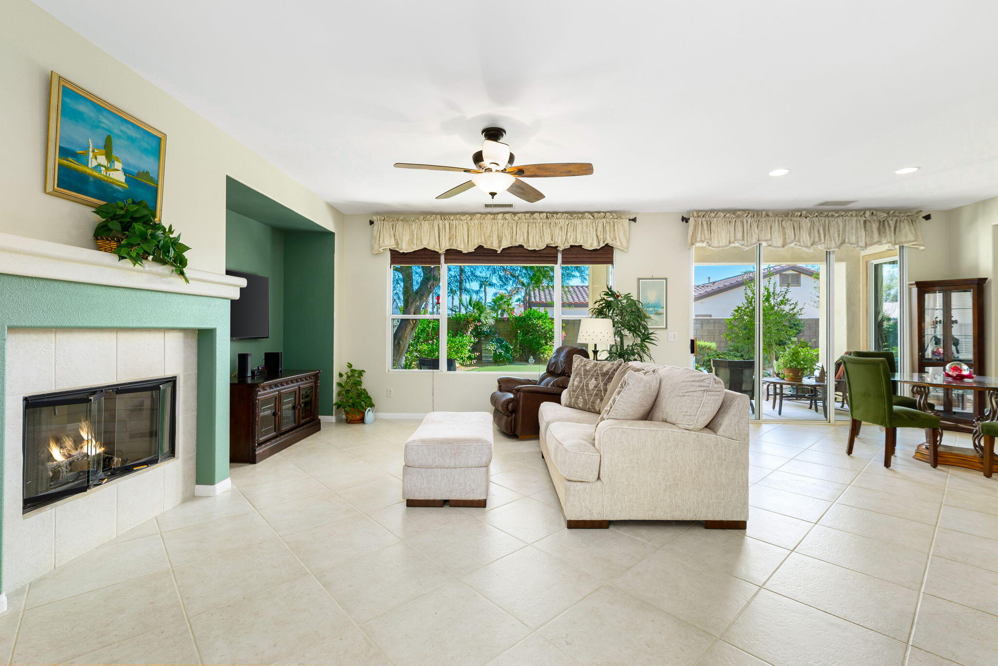 60246 Sweetshade Lane La Quinta, CA 92253 - Photo 9 of 76 a living room with furniture fireplace and large windows