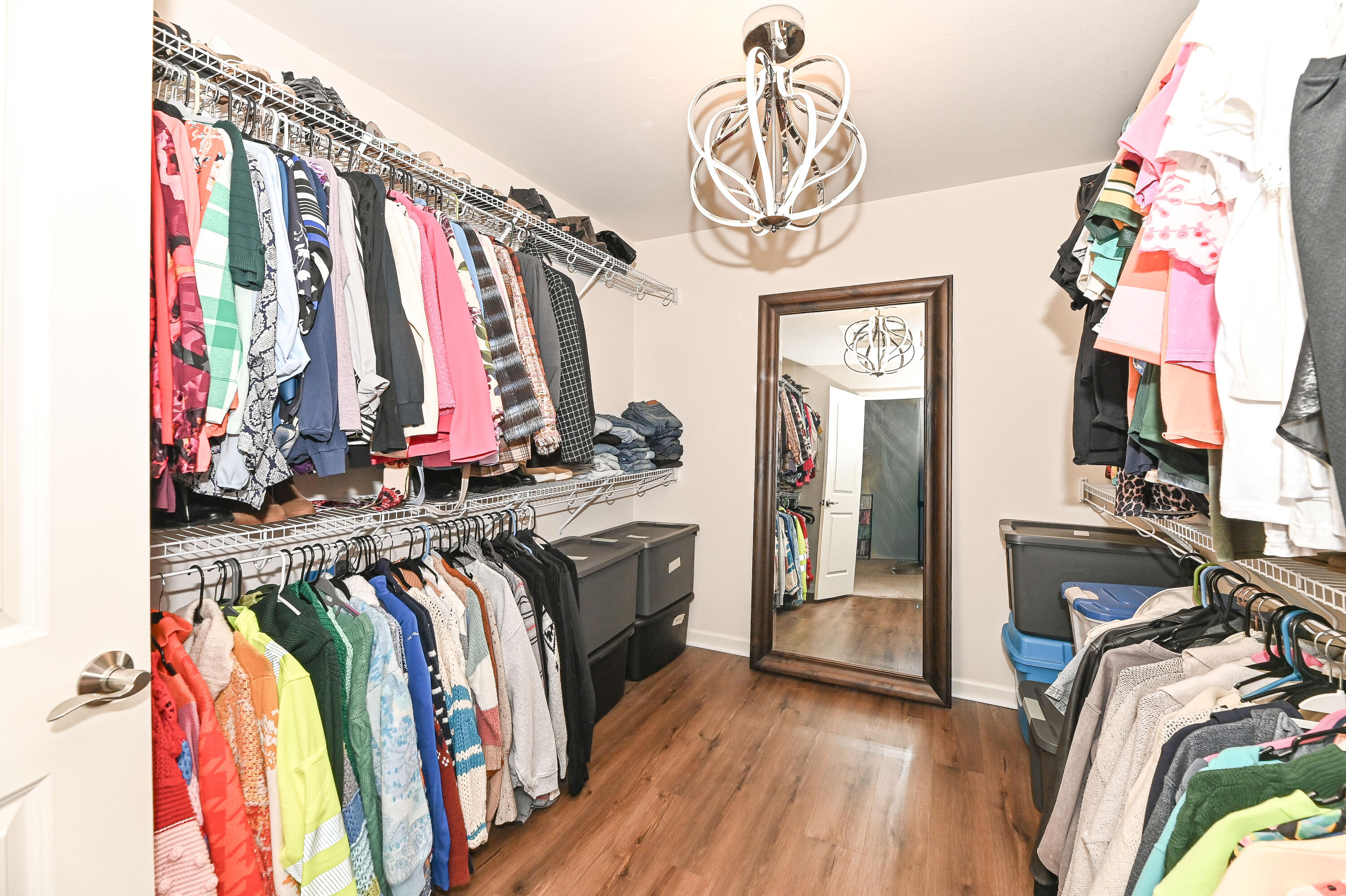 3805 Yates Road Mount Pleasant, WI 53406 - Photo 17 of 27 Spacious walk-in closet with abundant hanging space and shelving.