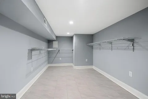 a view of a room with racks on the wall