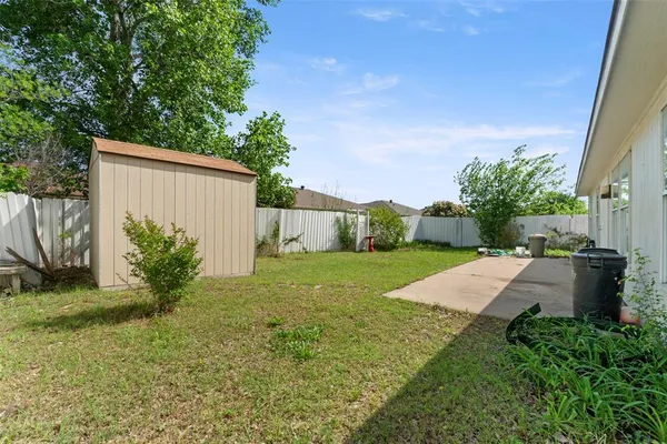 a house view with a backyard space