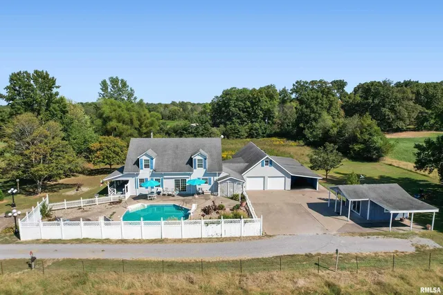 a view of house with outdoor space and swimming pool