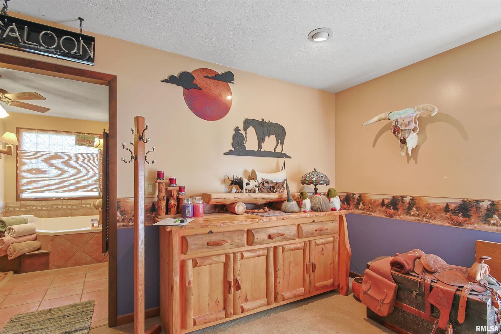 11939 Cochran Road Marion, IL 62959 - Photo 11 of 38 a bathroom with a sink mirror and vanity