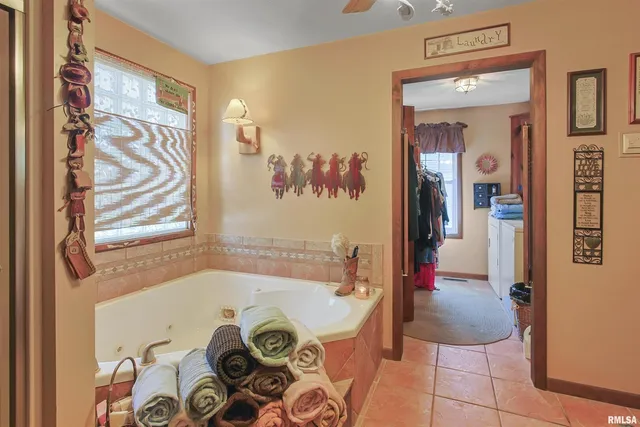a bathroom with a tub and shower