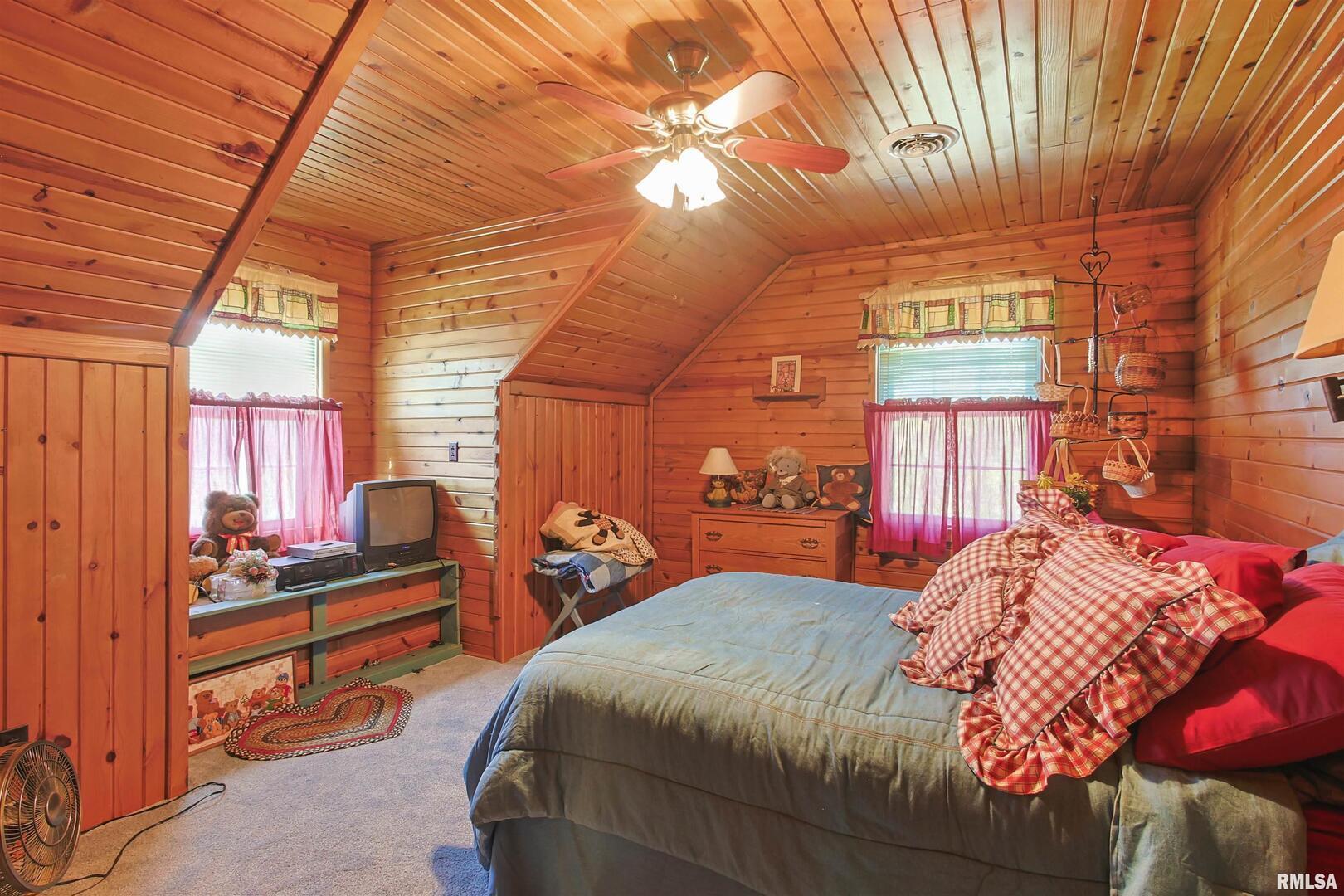 11939 Cochran Road Marion, IL 62959 - Photo 21 of 38 a bedroom with a bed and a window