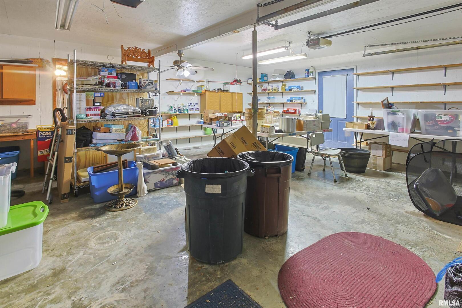 11939 Cochran Road Marion, IL 62959 - Photo 25 of 38 a room with lots of furniture and clutter