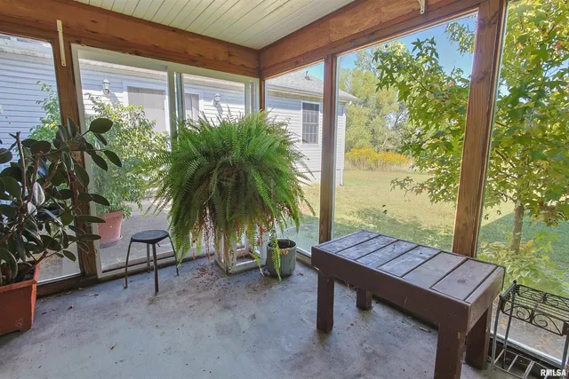 a view of a chairs and table on the wooden deck