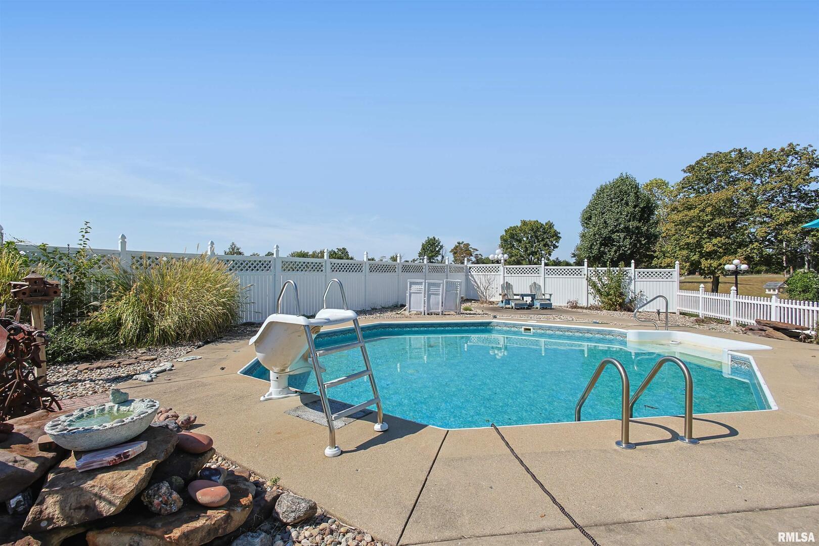 11939 Cochran Road Marion, IL 62959 - Photo 32 of 38 a view of a swimming pool with lounge chairs