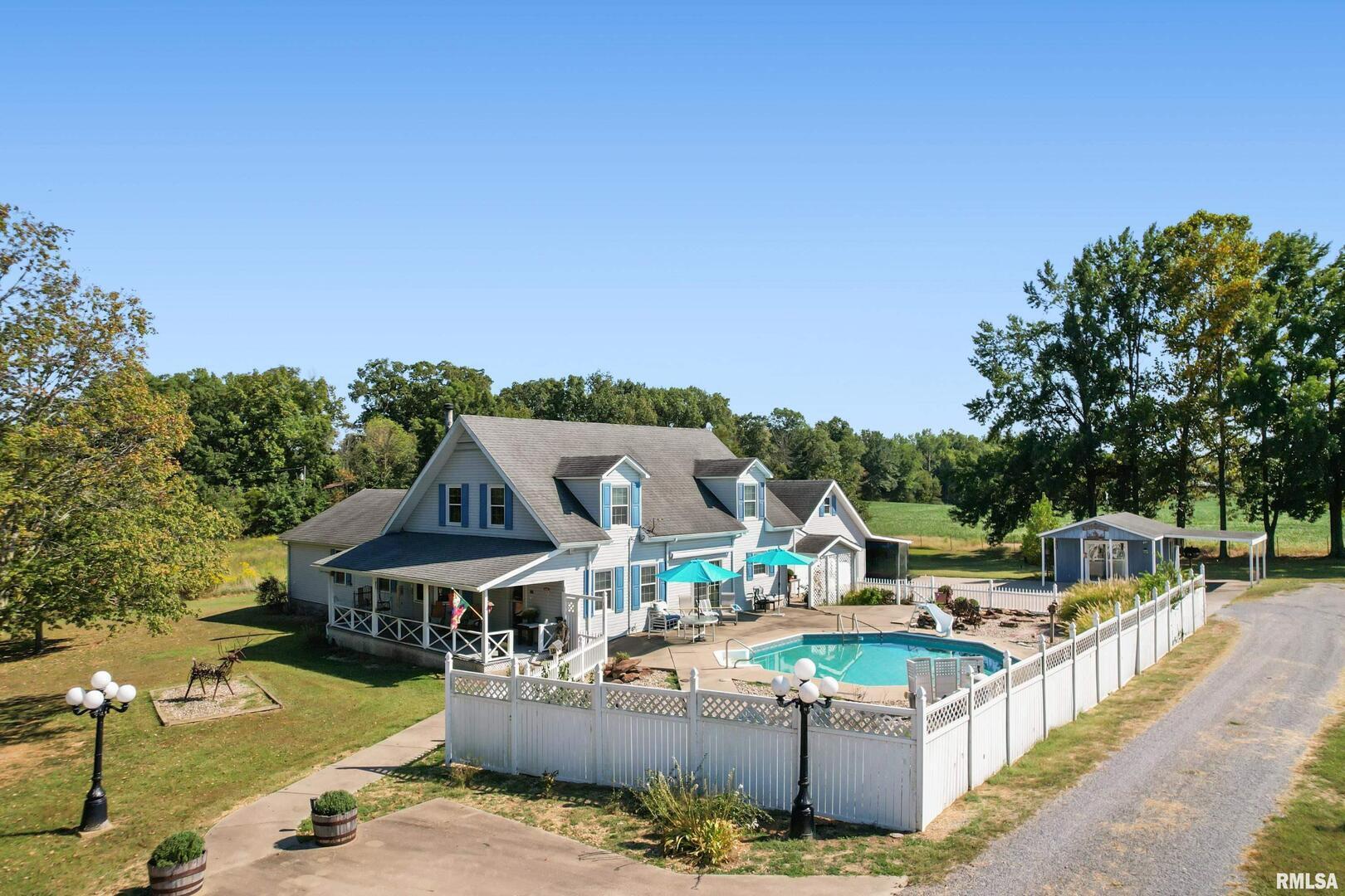 11939 Cochran Road Marion, IL 62959 - Photo 37 of 38 an aerial view of a house with a swimming pool
