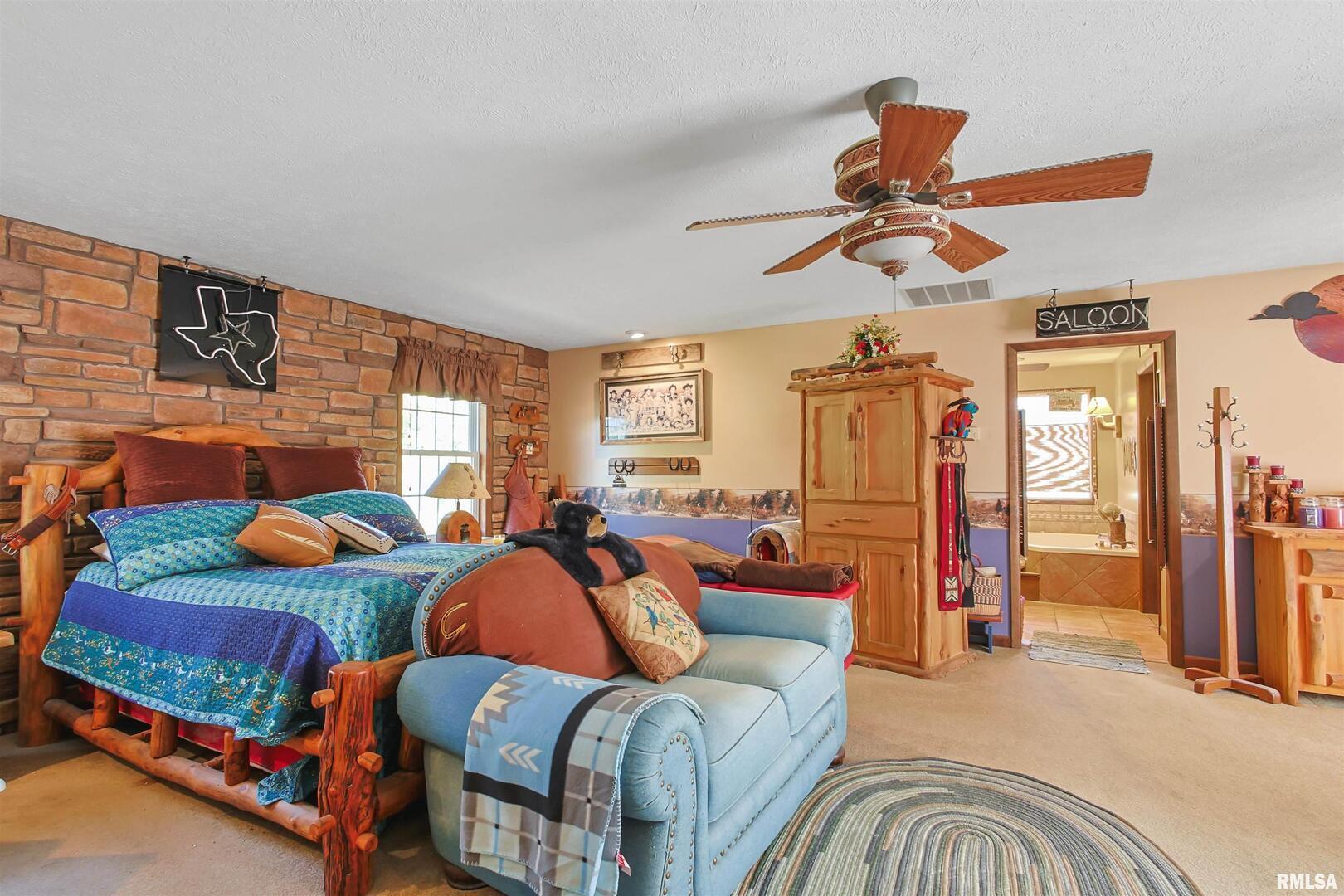 11939 Cochran Road Marion, IL 62959 - Photo 8 of 38 a bedroom with two beds and painting on the wall