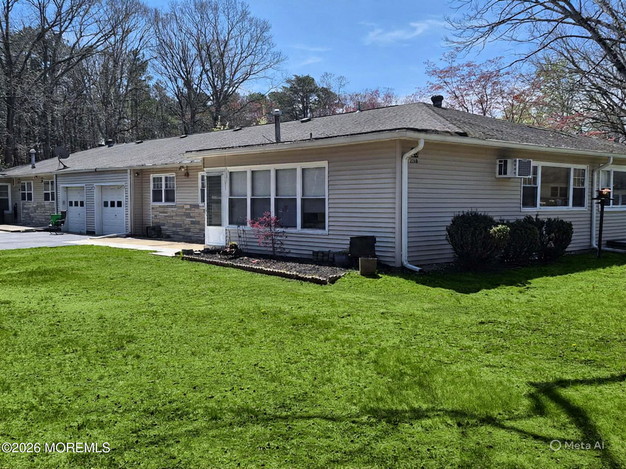 a view of a house with a backyard and a patio