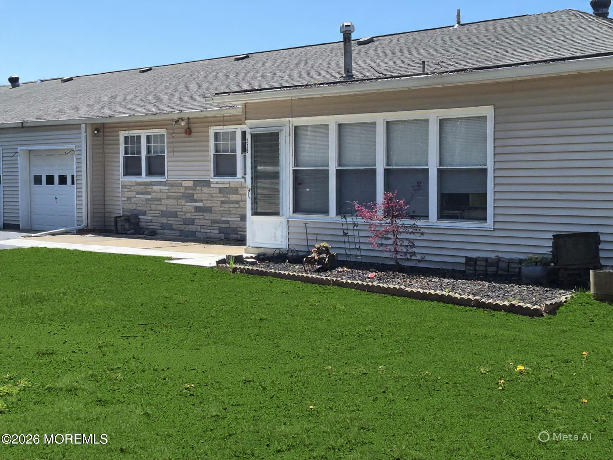 23 B E Road, Unit B Jackson, NJ 08527 - Photo 2 of 3 a front view of a house with a yard