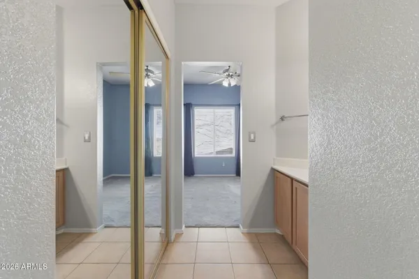 a view of a hallway with two rooms