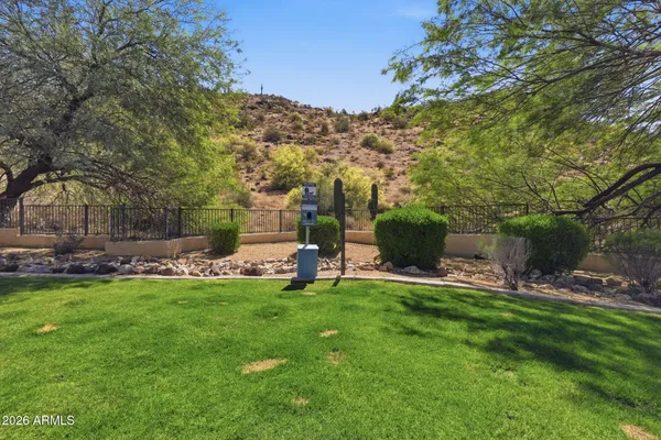 a view of a chair and table of the garden
