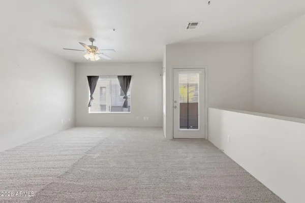 a view of an empty room with a window