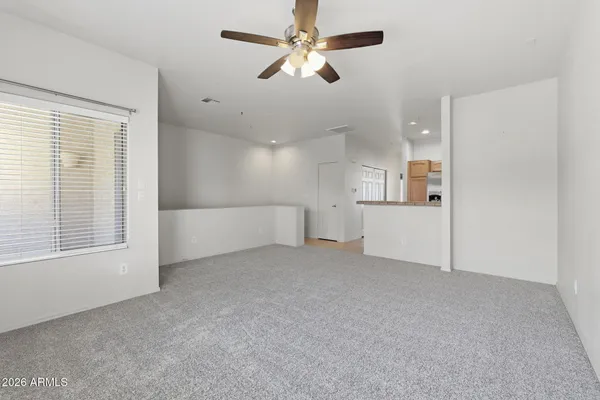 a view of an empty room with a window