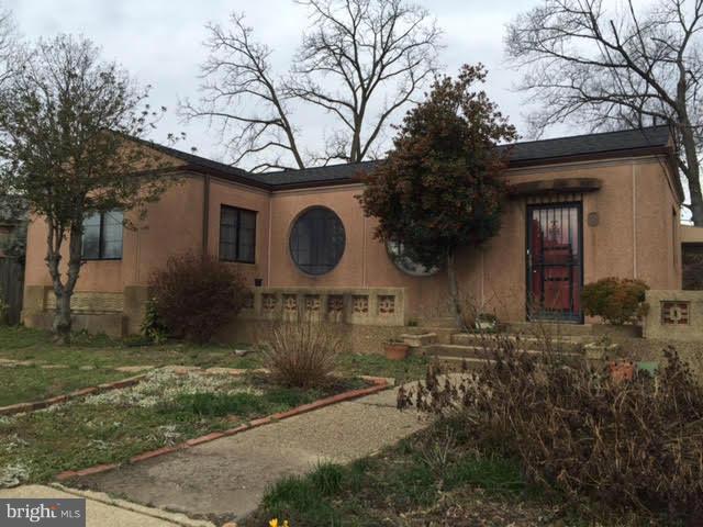 9904 Colesville Road Silver Spring, MD 20901 - Photo 1 of 23 a front view of a house with garden