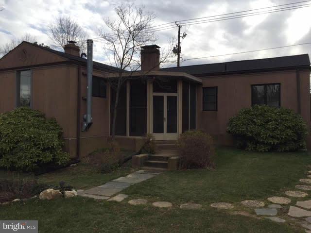 9904 Colesville Road Silver Spring, MD 20901 - Photo 2 of 23 a view of a house with a yard