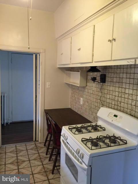 9904 Colesville Road Silver Spring, MD 20901 - Photo 13 of 23 a stove top oven sitting inside of a kitchen