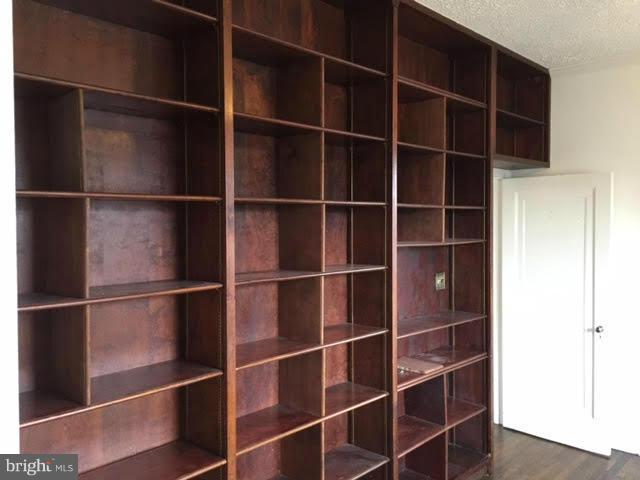9904 Colesville Road Silver Spring, MD 20901 - Photo 19 of 23 a view of a closet with empty racks