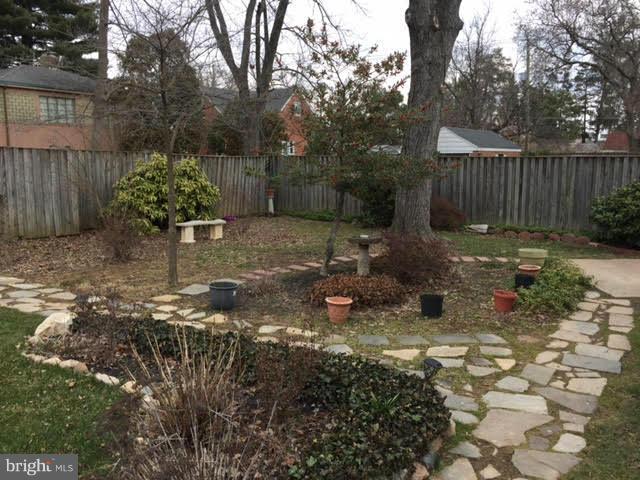 9904 Colesville Road Silver Spring, MD 20901 - Photo 3 of 23 a backyard of a house with lots of green space